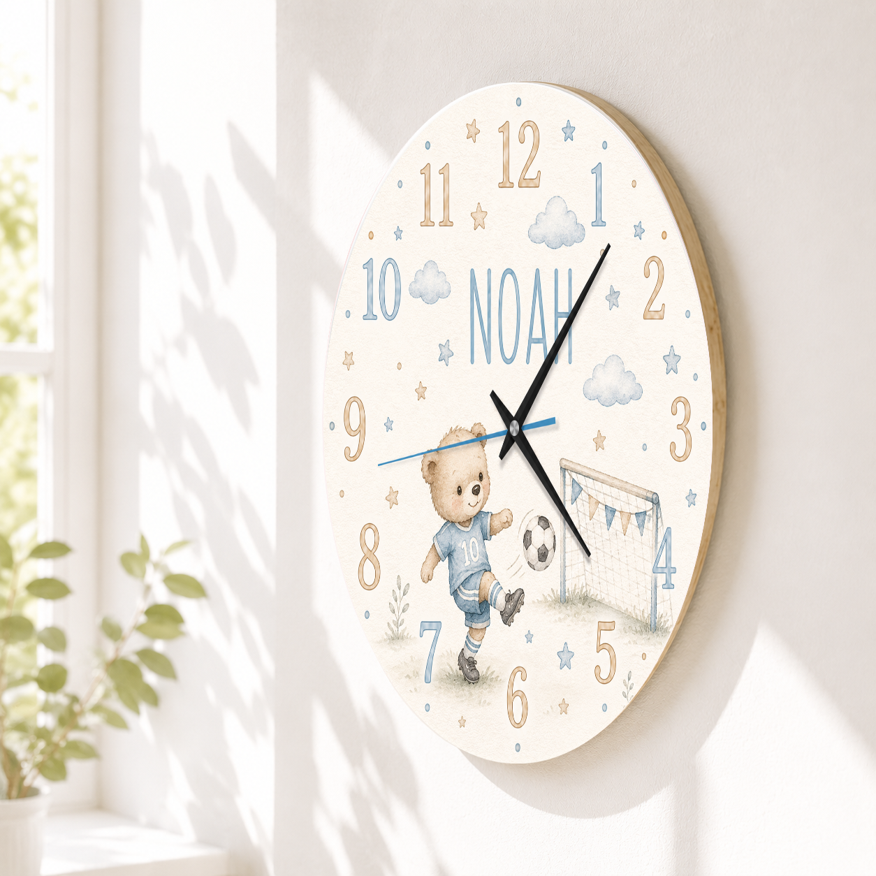 Silent wall clock for children with football motif